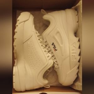New pair of Fila. Never worn. Brand new in box, size 9 women